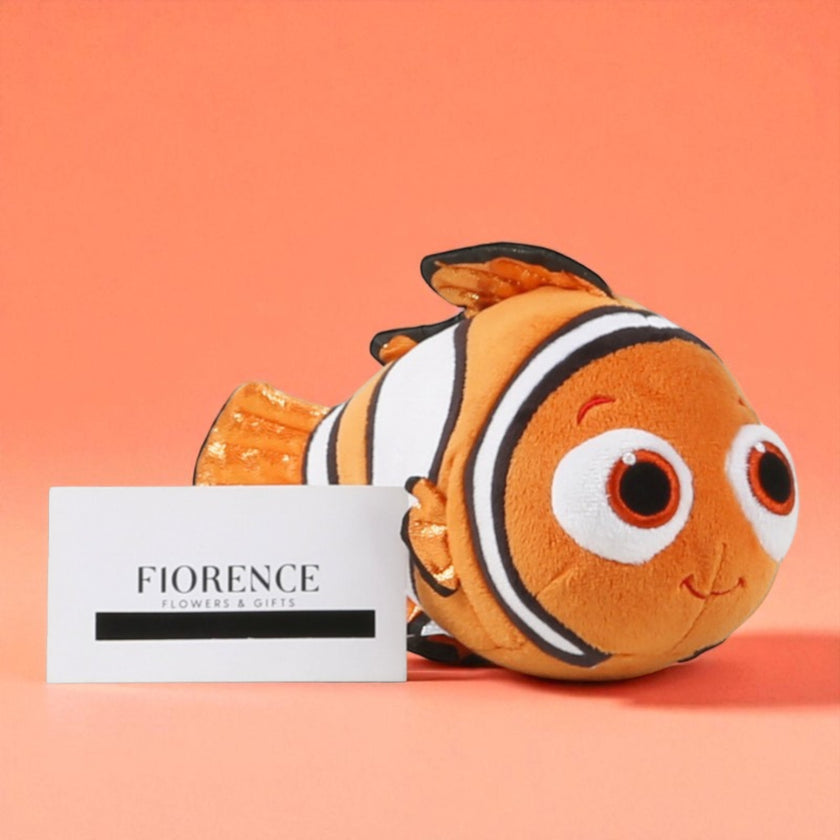 Nemo and Dory plush toys with chocolates and cookies